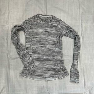 Lululemon Long Sleeve Top with Rear Pocket and slight split hem detail